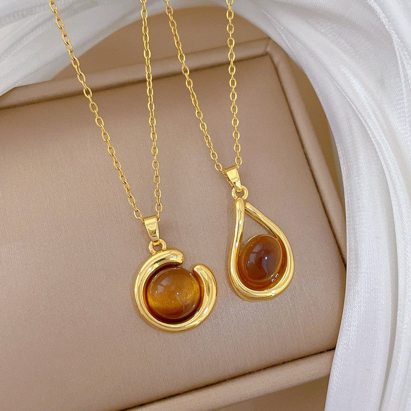 Elegant Amber Teardrop & Swirl Necklace Set