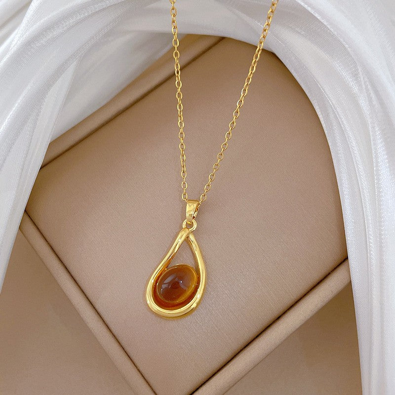 Elegant Amber Teardrop & Swirl Necklace Set