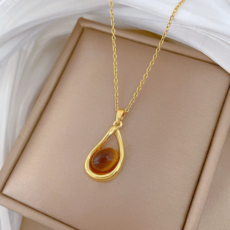 Elegant Amber Teardrop & Swirl Necklace Set