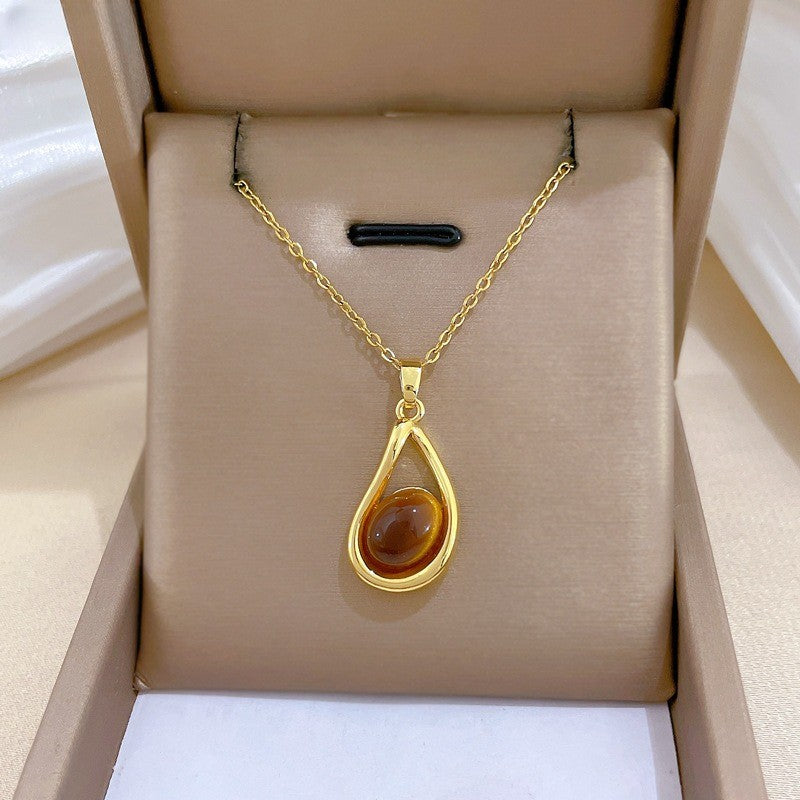 Elegant Amber Teardrop & Swirl Necklace Set