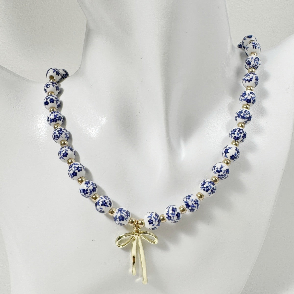 Elegant Blue Floral Bead Bow Necklace