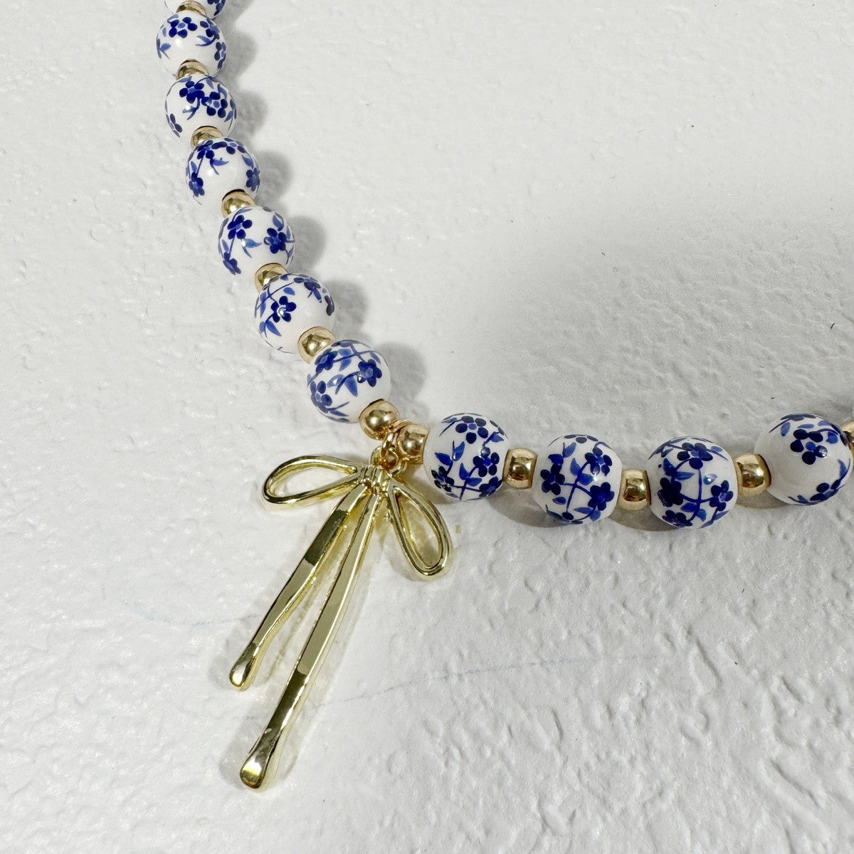 Elegant Blue Floral Bead Bow Necklace