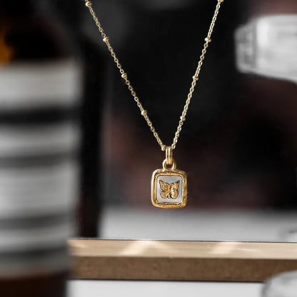 Feminine Gold Accented Butterfly Square Pendant Necklace