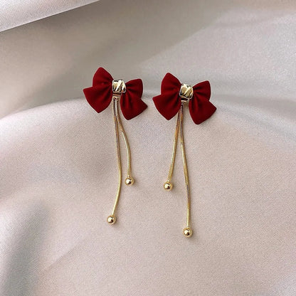 Dainty Bow Gold Dangle Earrings - Veinci