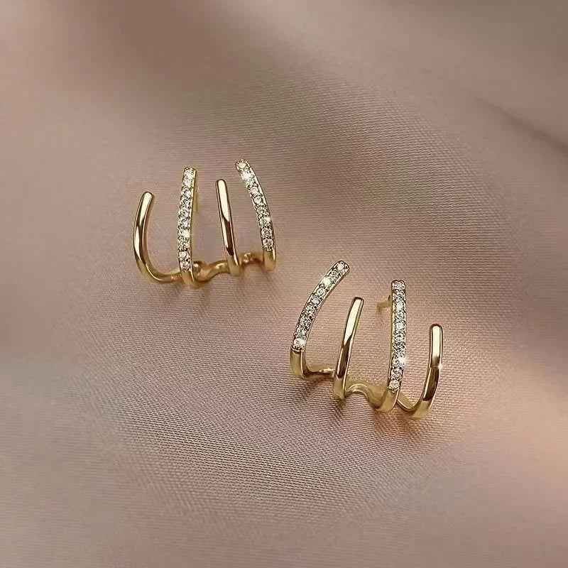 Dainty Shimmering Claw Huggie Earrings - Veinci