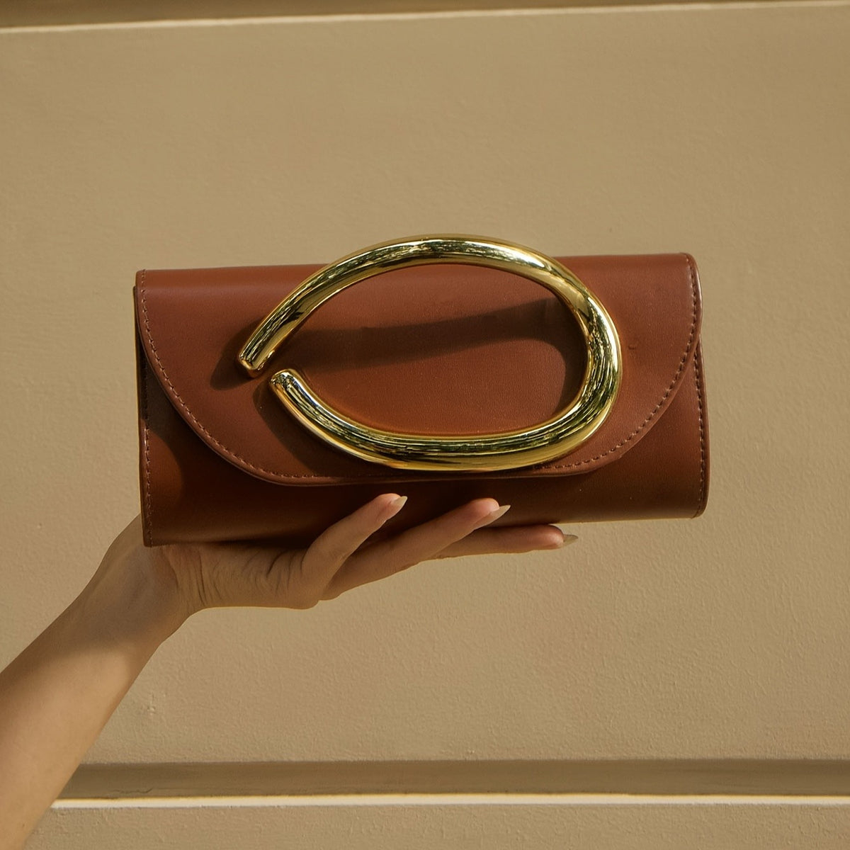 Classy Oval Metal Handle Clutch