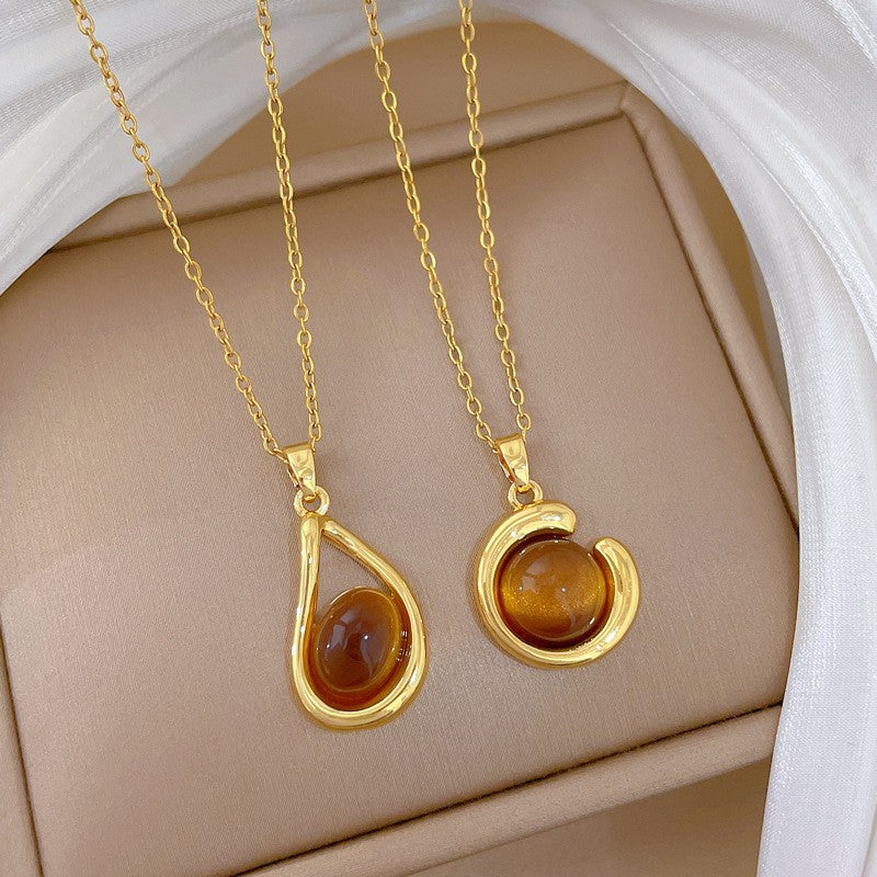 Elegant Amber Teardrop & Swirl Necklace Set