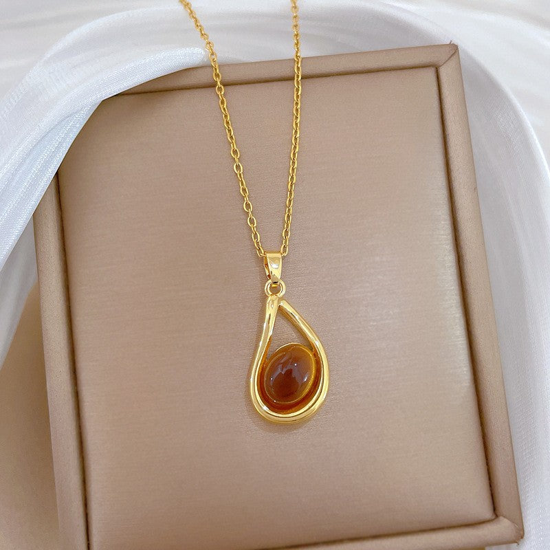 Elegant Amber Teardrop & Swirl Necklace Set