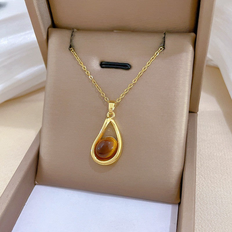 Elegant Amber Teardrop & Swirl Necklace Set