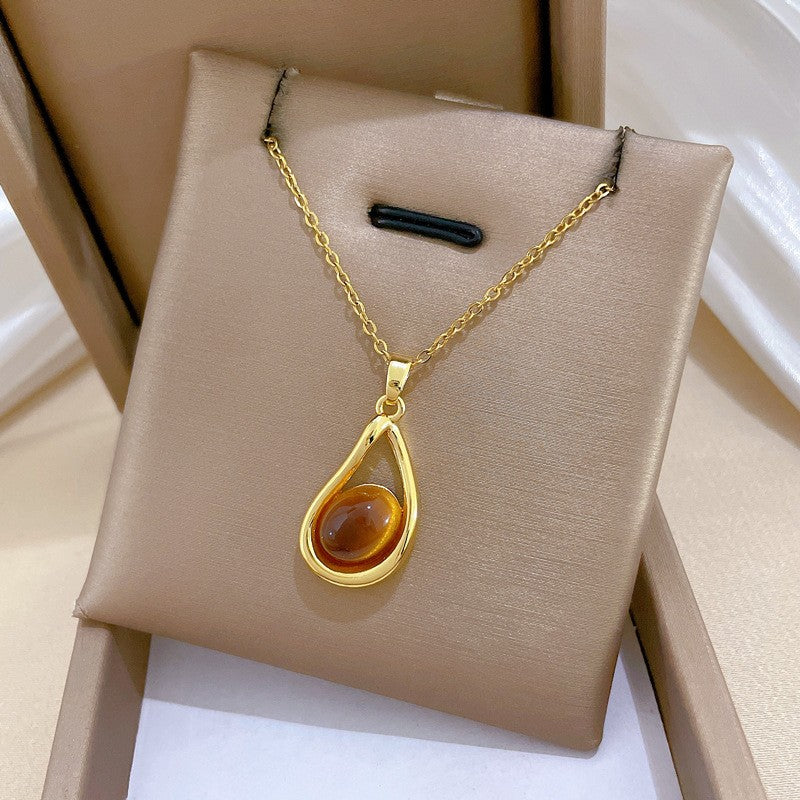 Elegant Amber Teardrop & Swirl Necklace Set