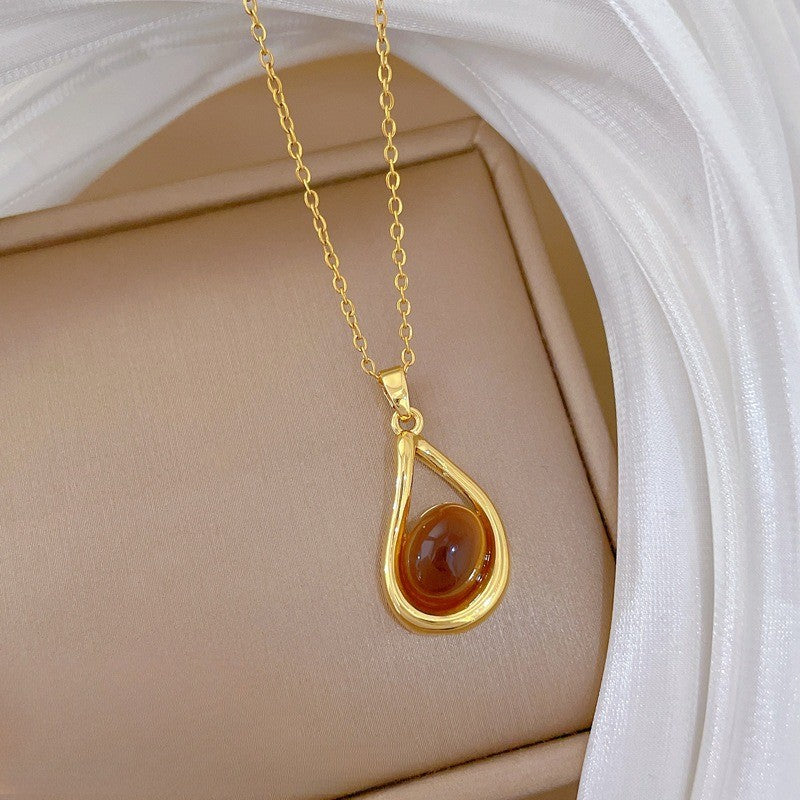 Elegant Amber Teardrop & Swirl Necklace Set
